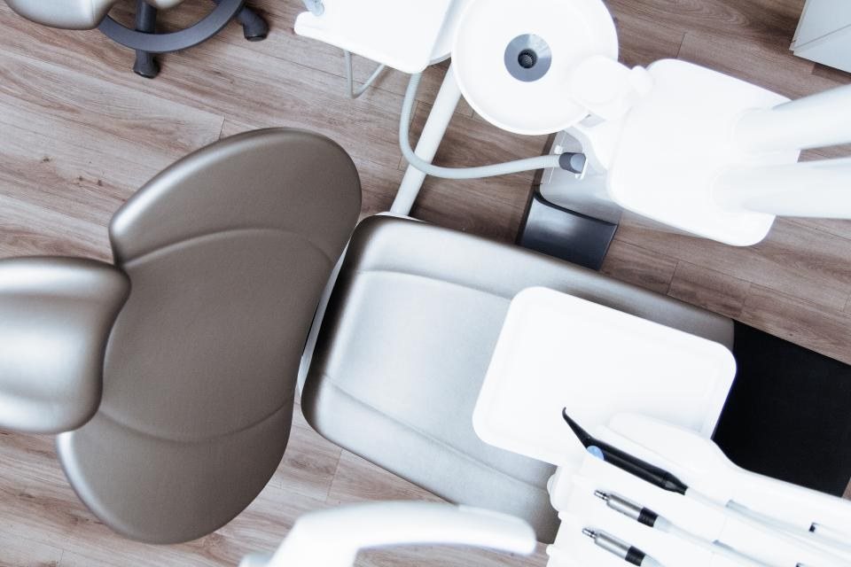 Dental chair in a bright treatment room